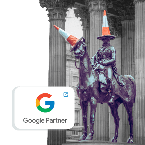 A whimsical twist on statuary: a horse and its rider both adorned with orange traffic cones as hats, set against a classical architectural backdrop, with a "google partner" badge overlayed in the foreground.